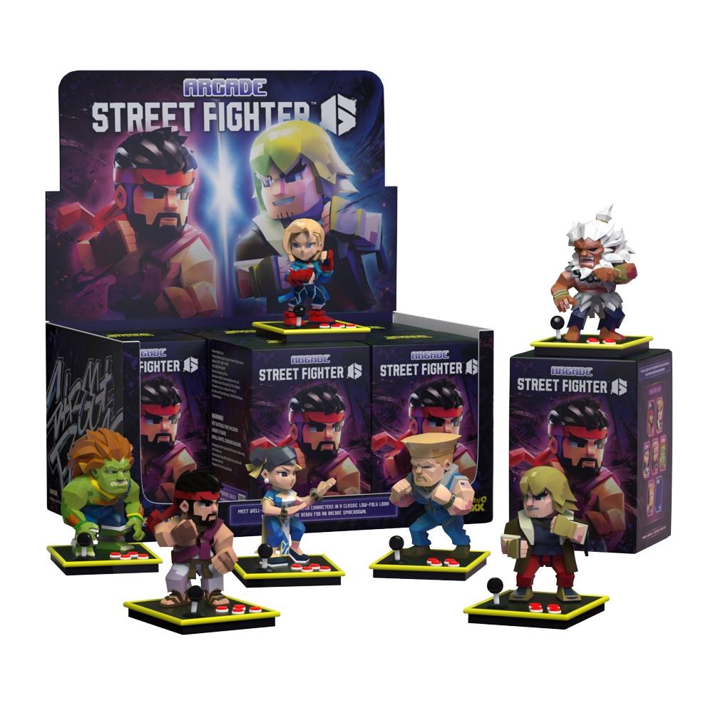 Display box of Arcade Street Fighter 6 collectible figures with six characters standing on joystick bases in front of the box