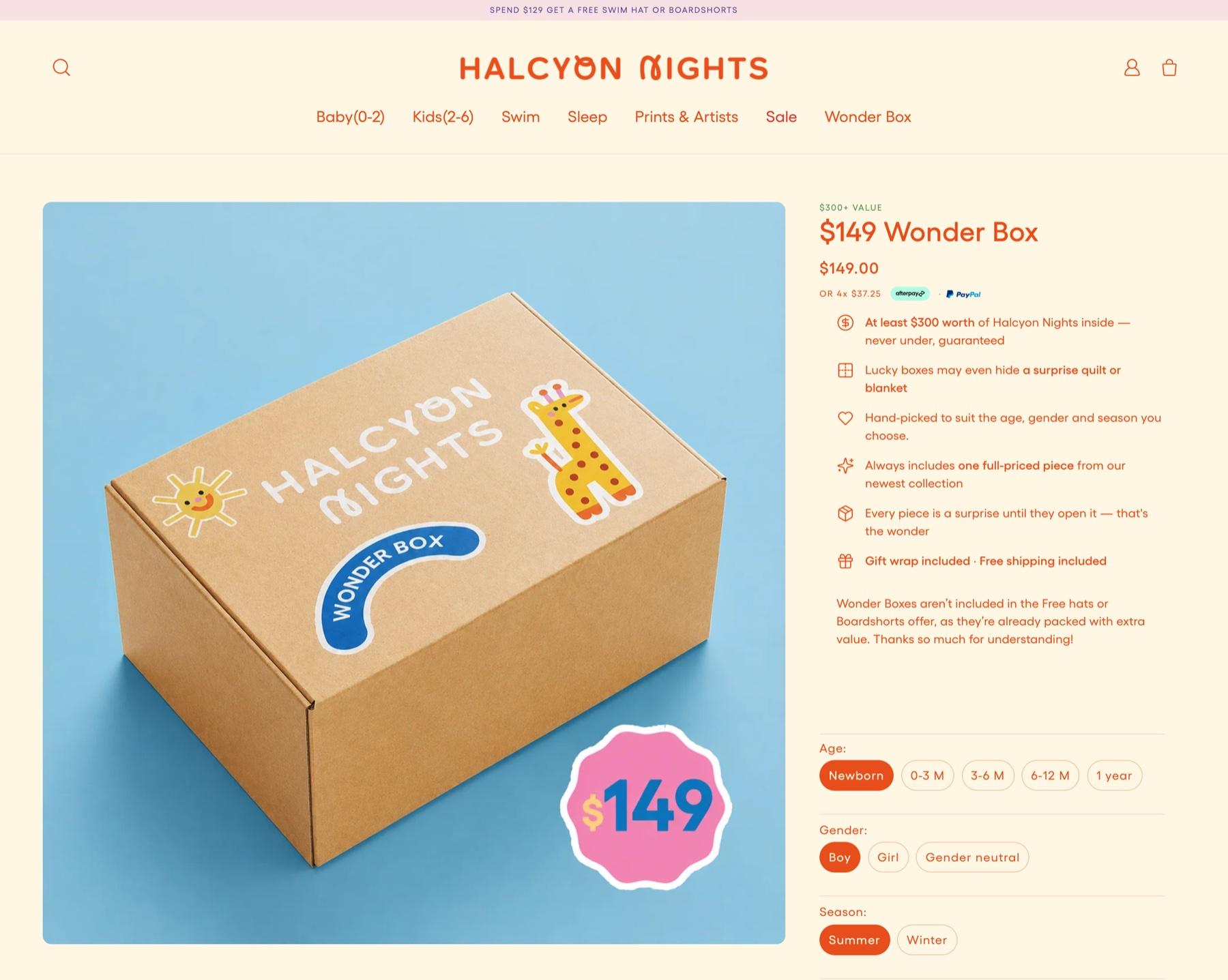 Halcyon Nights $149 Wonder Box page, priced $149.00, with a kraft box with a giraffe and sun sticker, the line at least $300 worth inside, and choices for age, gender and season