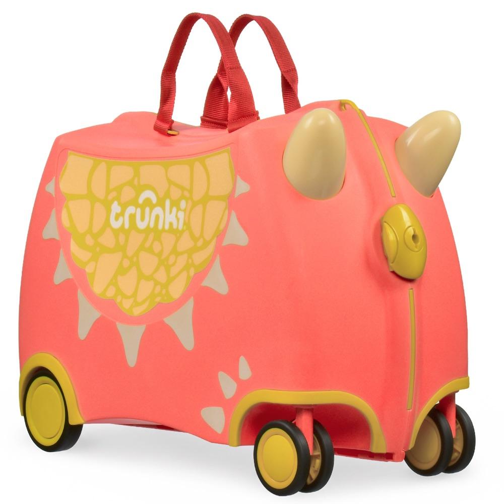 Coral Trunki ride-on suitcase styled as a dragon with a scaled panel and yellow wheels, on a white background