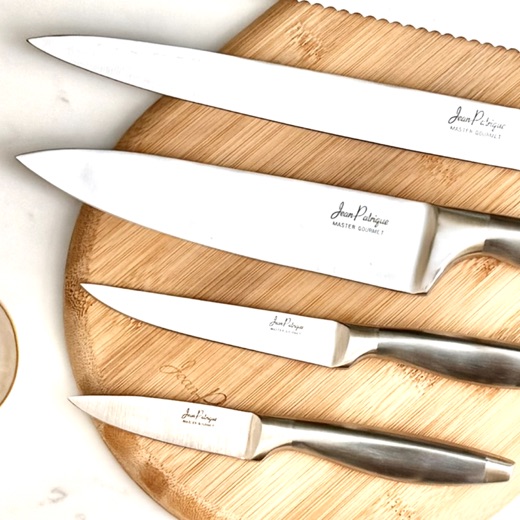 Jean Patrique Master Gourmet knives on a bamboo board