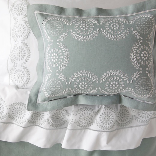 Embroidered sage green and white bedding