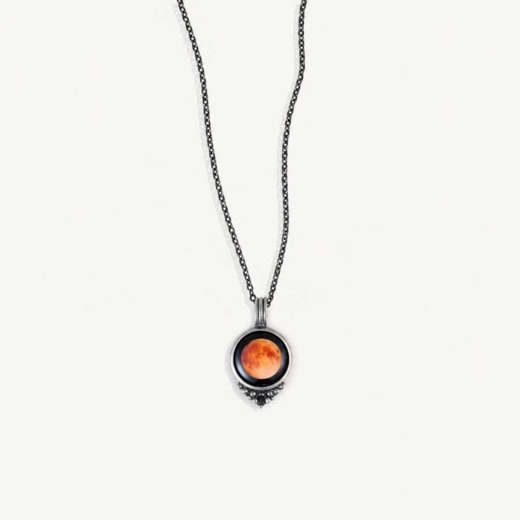Moonglow Harvest Moon necklace with an orange moon pendant